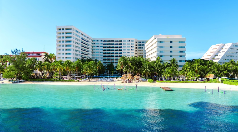 The Sens Cancun by Oasis, one of the top cancun all inclusive resorts, with its beachfront pool and palm-lined grounds in the Hotel Zone