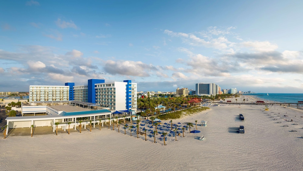 Hilton Clearwater Beach Resort & Spa beachfront tower and pool, one of the top clearwater beach hotels near Pier 60