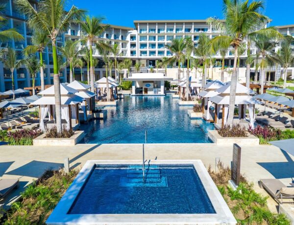 Beachfront pool and palm trees at one of the best Dominican Republic all inclusive resorts in Punta Cana