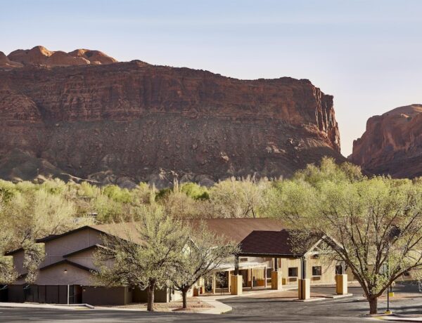 Slackline Moab, Outset Collection by Hilton, one of the best Moab hotels, with its outdoor pool and desert red rock backdrop