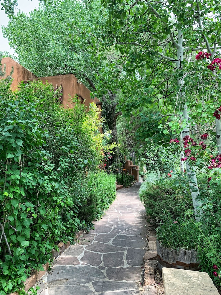 Inn on the Alameda, one of the most romantic hotels Santa Fe offers, with its low adobe buildings and garden terrace